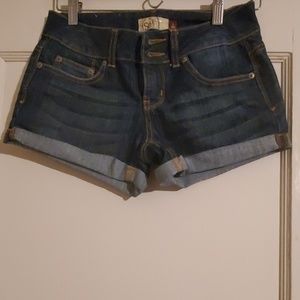 Rolled blue jean shorts